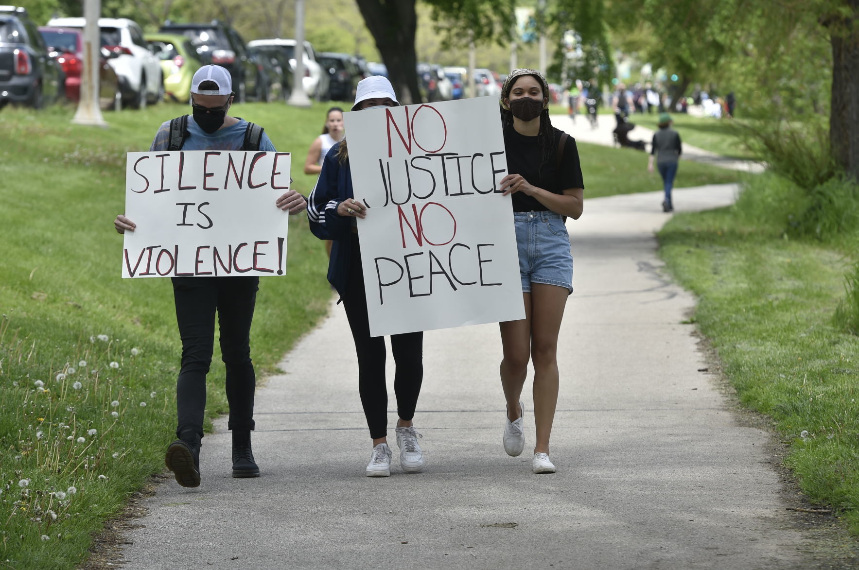 Silence is Violence and No Justice No Peace signs preceding the protest